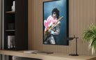 Prince Live at The Forum by Michael Ochs Archives, vibrant concert photograph of Prince performing in pink feathers and sequins, fine art print framed by The Picturalist