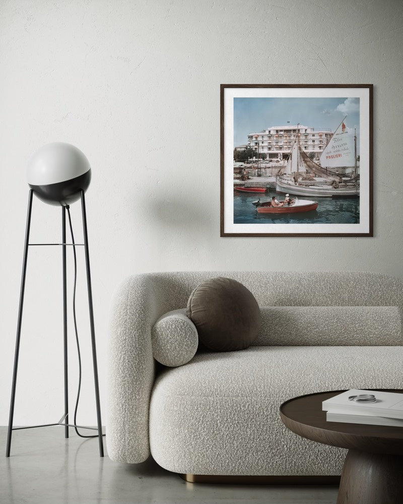 Savioli Spiaggia Hotel, Riccione by Slim Aarons displayed in a sophisticated coastal living room, bringing Mediterranean elegance and designer-grade wall decor to luxury interiors.