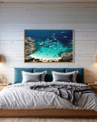 Porto Rotondo by Slim Aarons shown above a modern bed setting, Chromaluxe metal print curated by The Picturalist for serene bedroom interiors.