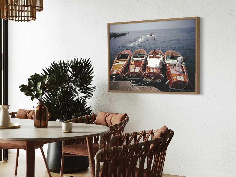 Riva Boats at Hôtel du Cap-Eden-Roc by Slim Aarons displayed in a hospitality dining setting, luxury metal print styled for boutique hotels and resort interiors by The Picturalist.