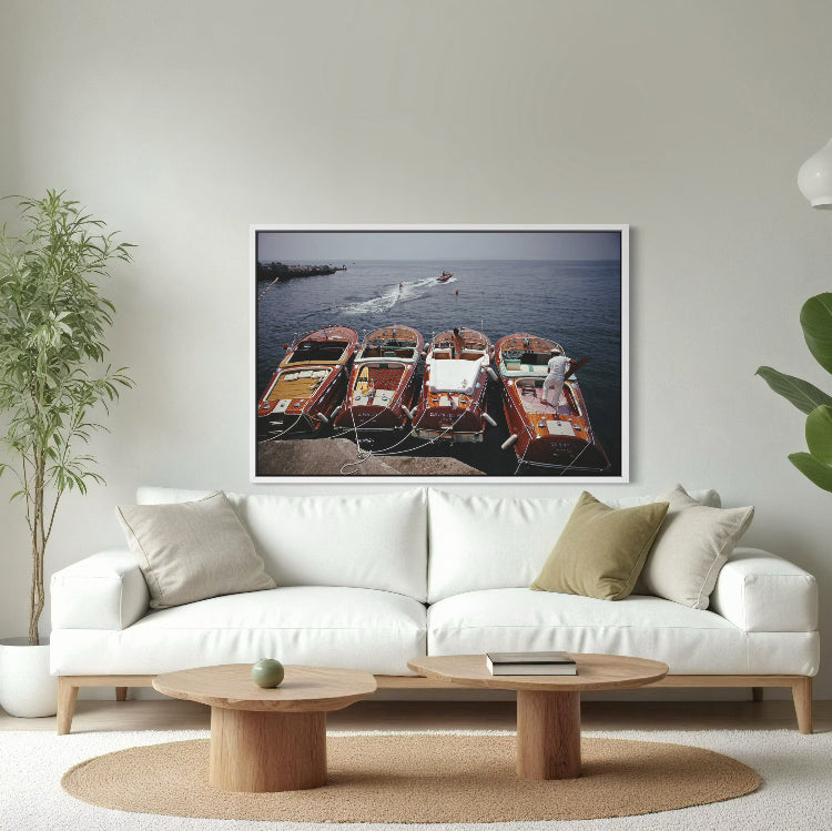 Riva Boats at Hôtel du Cap-Eden-Roc by Slim Aarons displayed in a contemporary living room, Chromaluxe metal print styled for luxury residential interiors by The Picturalist.