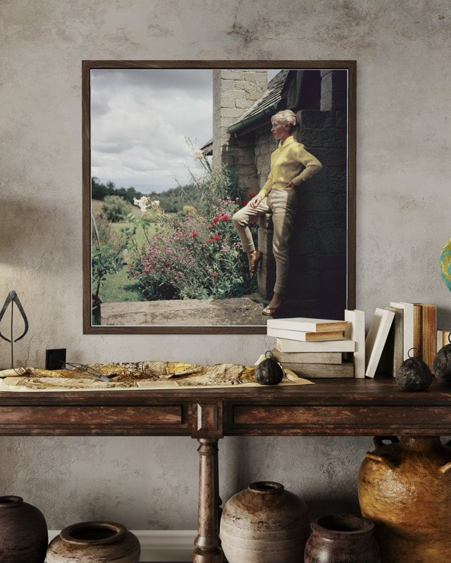 The Mason's Estate, Kenya by Slim Aarons installed in a country house,  rustic living-room, enhancing farmhouse interiors with globally inspired artwork.