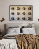 Twelve Hats of the Frontier shown above a bedroom setting, framed Modern Americana artwork curated by The Picturalist.