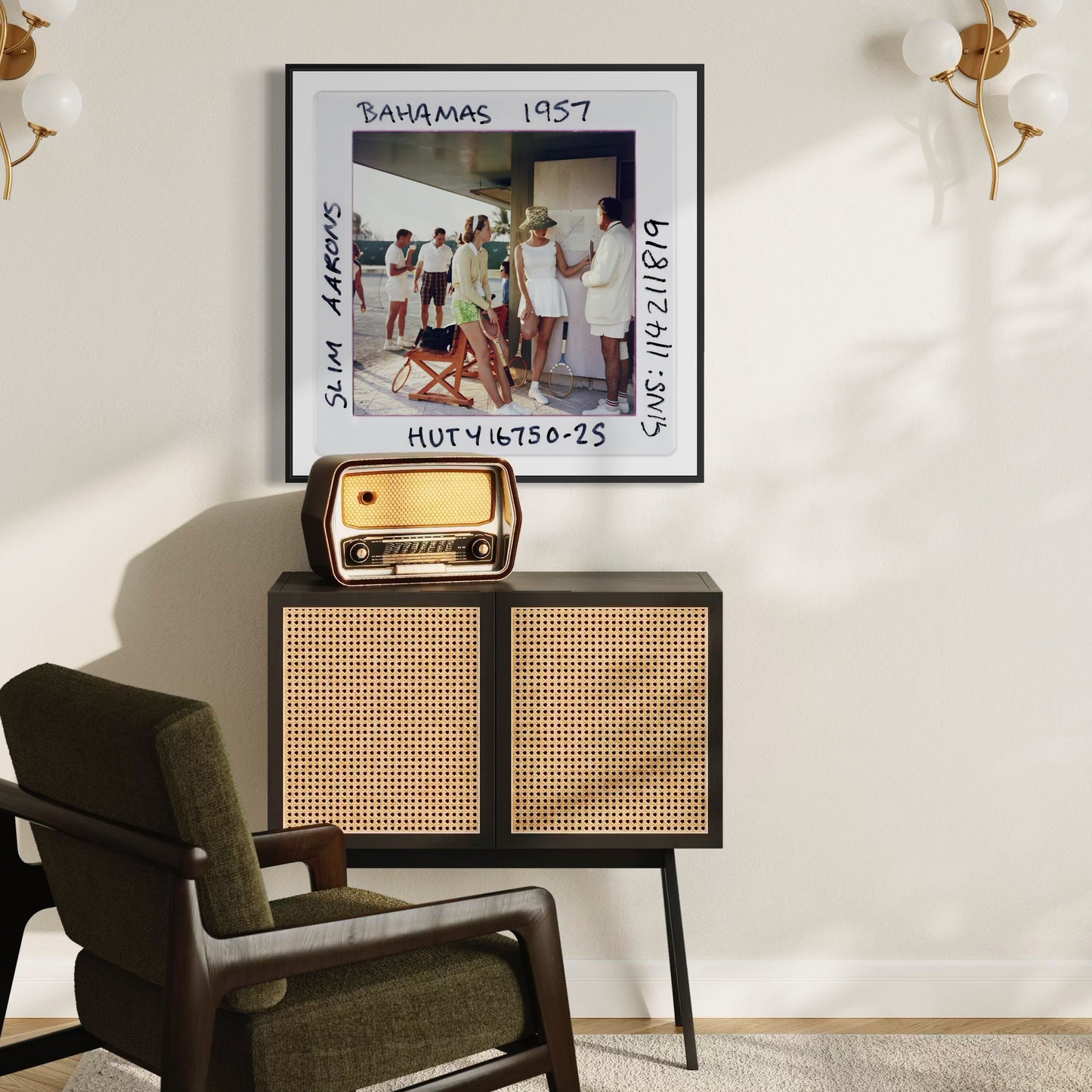 Vintage-style radio on a cabinet with a framed photo above in a room with a chair and wall decor.