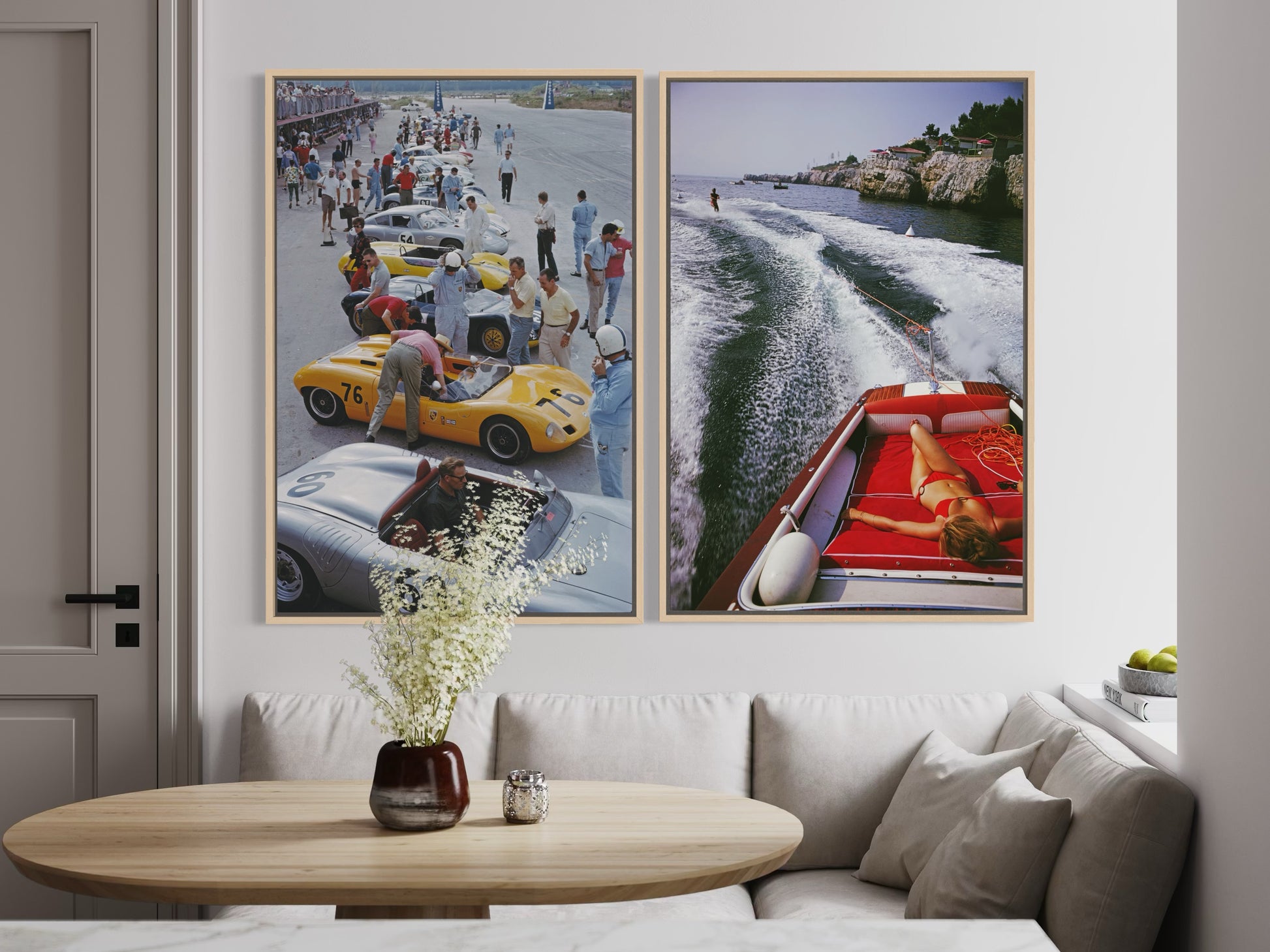 Two framed pictures of vintage cars and a boat on a wall above a sofa.