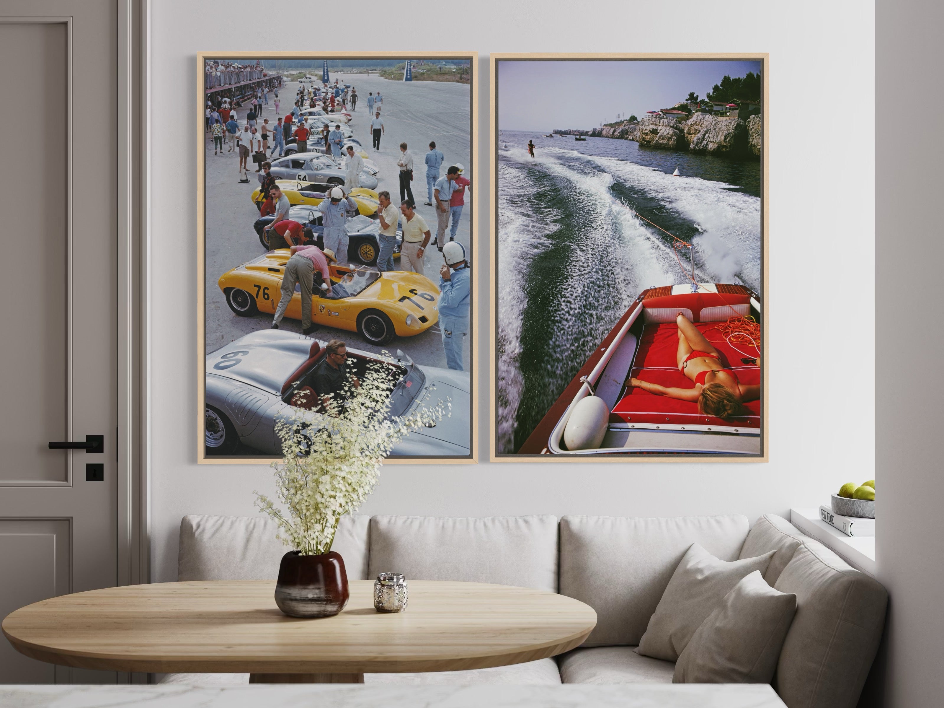 Two framed pictures of vintage cars and a boat on a wall above a sofa.