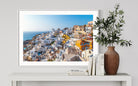 Beautiful View of Oia in Santorini by George Pachantouris, fine art photograph of whitewashed homes and Aegean Sea, framed by The Picturalist