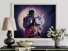 Framed artwork of a couple on a wall above a table with decorative items.