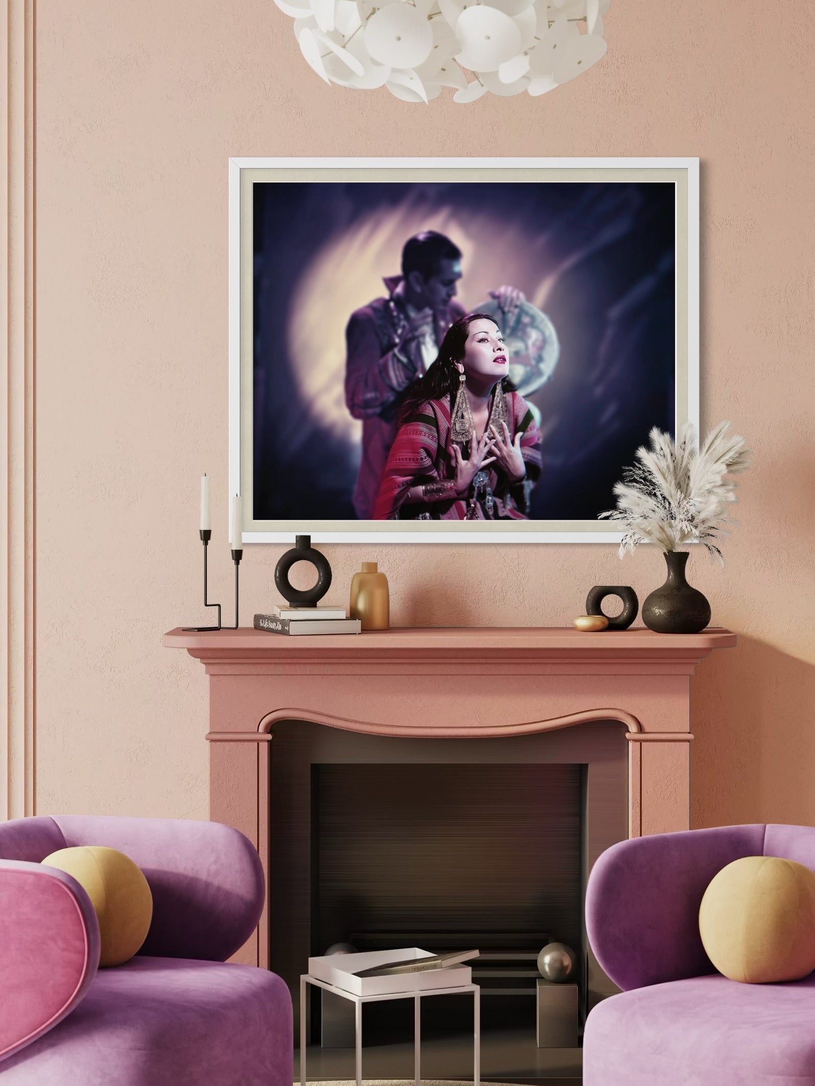 Living room with pink walls, purple armchairs, and a framed artwork above a fireplace.