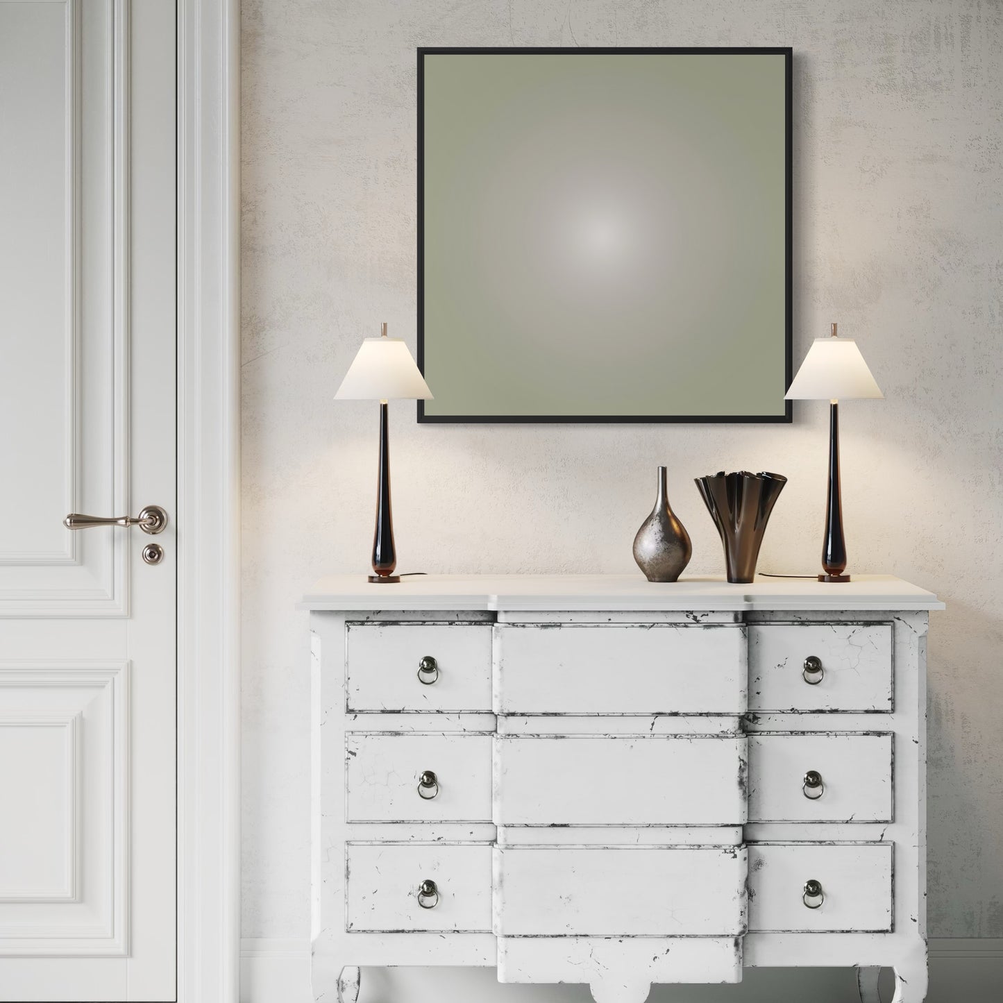 White distressed dresser with two lamps and decorative vases against a neutral wall.