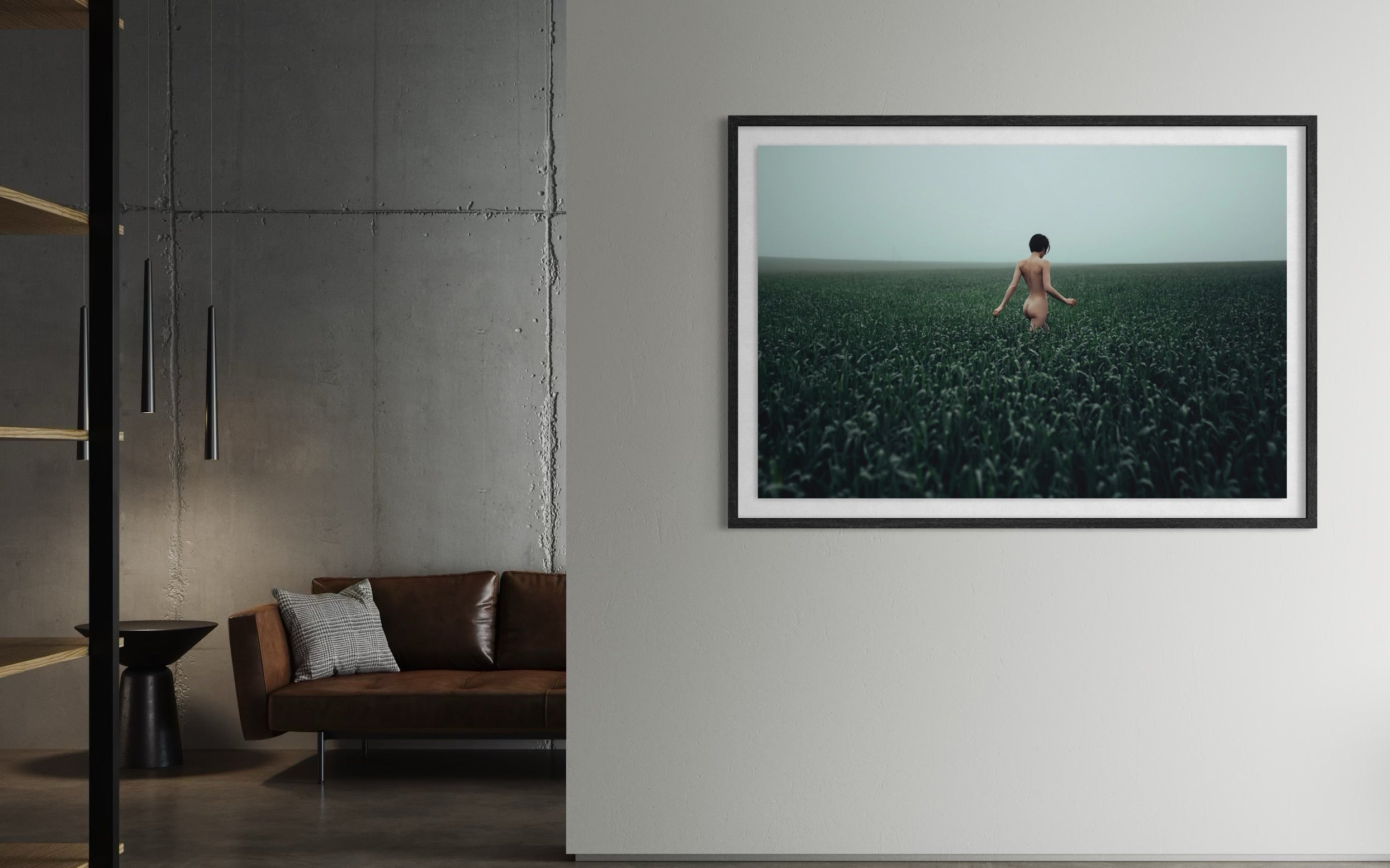 Framed artwork of a person in a field on a wall in a modern living room.