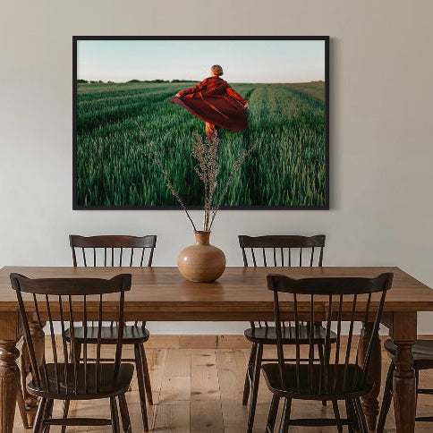 Walking at Sunset by Igor Ustynskyy, showing a figure in a long coat moving through a lush field at golden hour, available from The Picturalist for designer-grade wall decor, curated art collections, and tailored art solutions for residential, hospitality, and commercial spaces.
