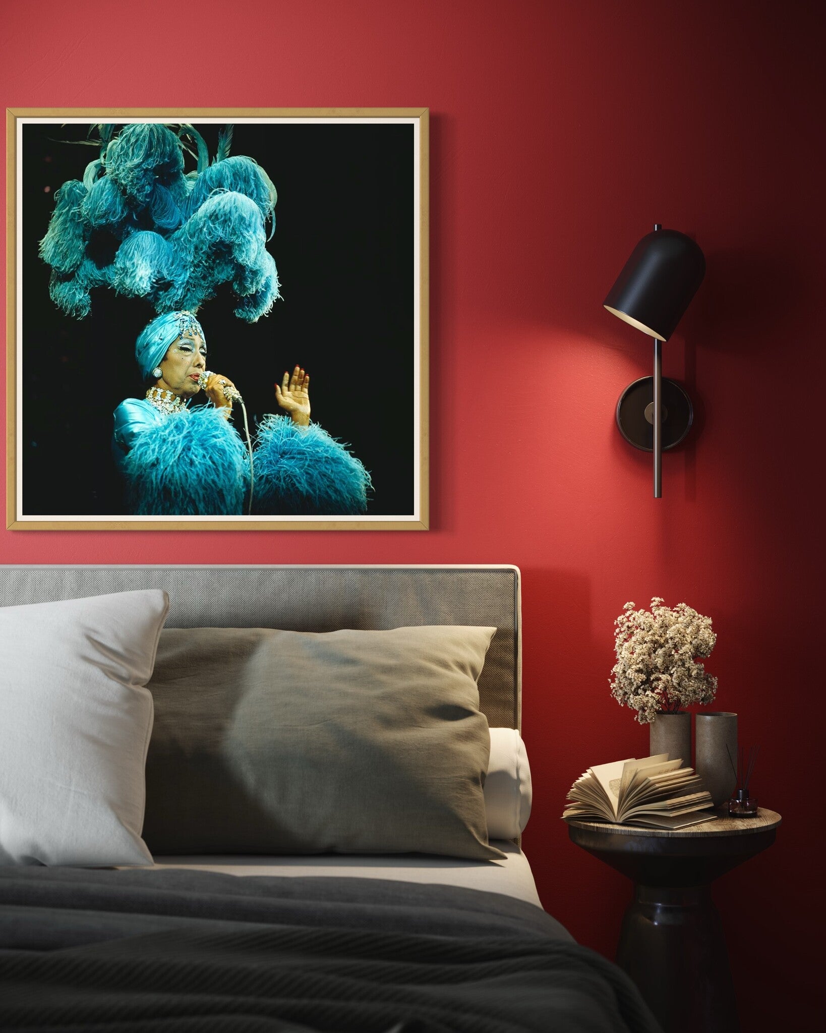 Josephine Baker performing on stage captured by David Redfern for Getty Images on a red wall