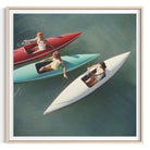 Framed square art print depicting three people in small boats on blue-green water, shown in a light wood frame with a white mat.