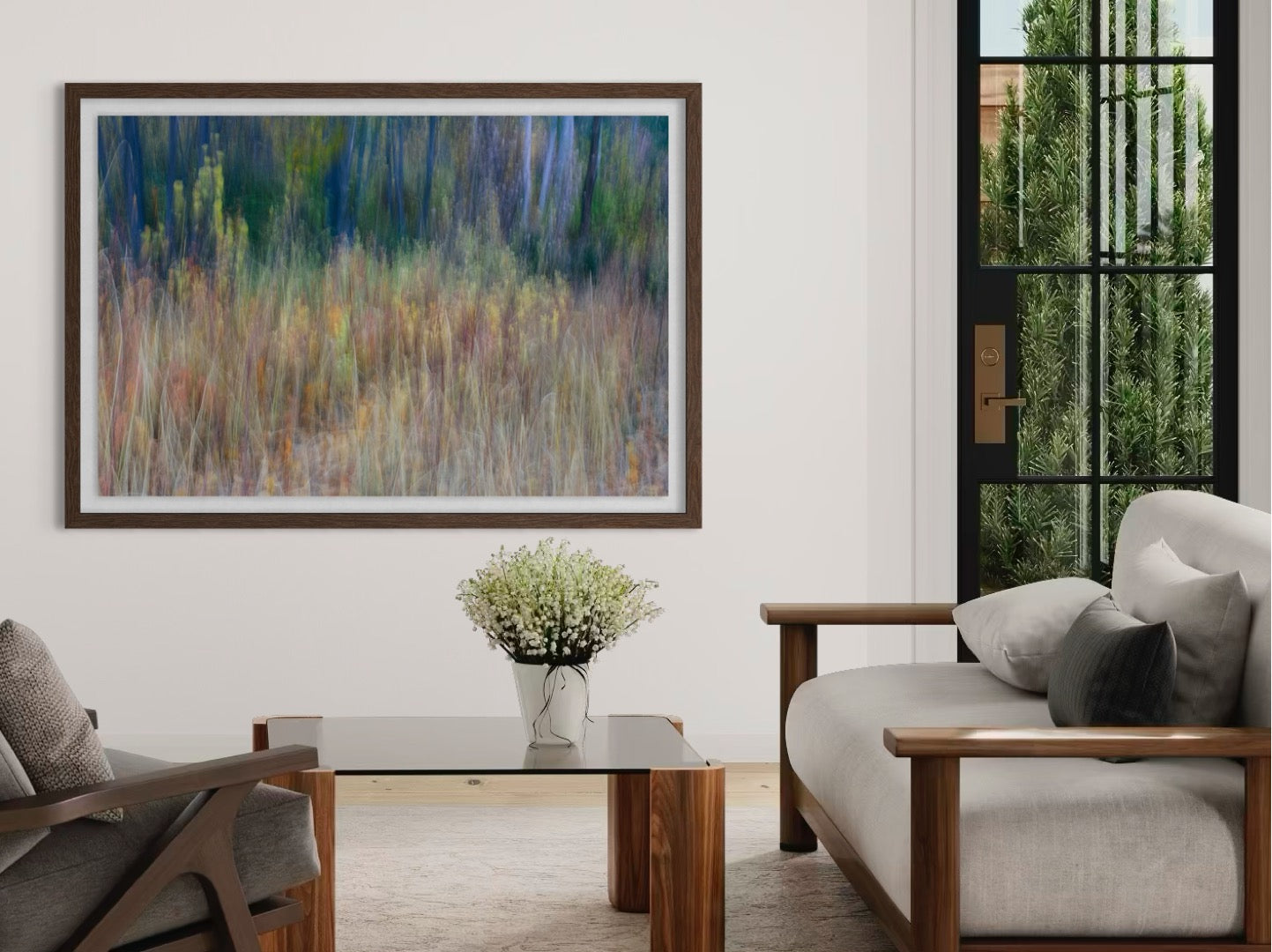 Living room with a painting on the wall, a sofa, and a coffee table.