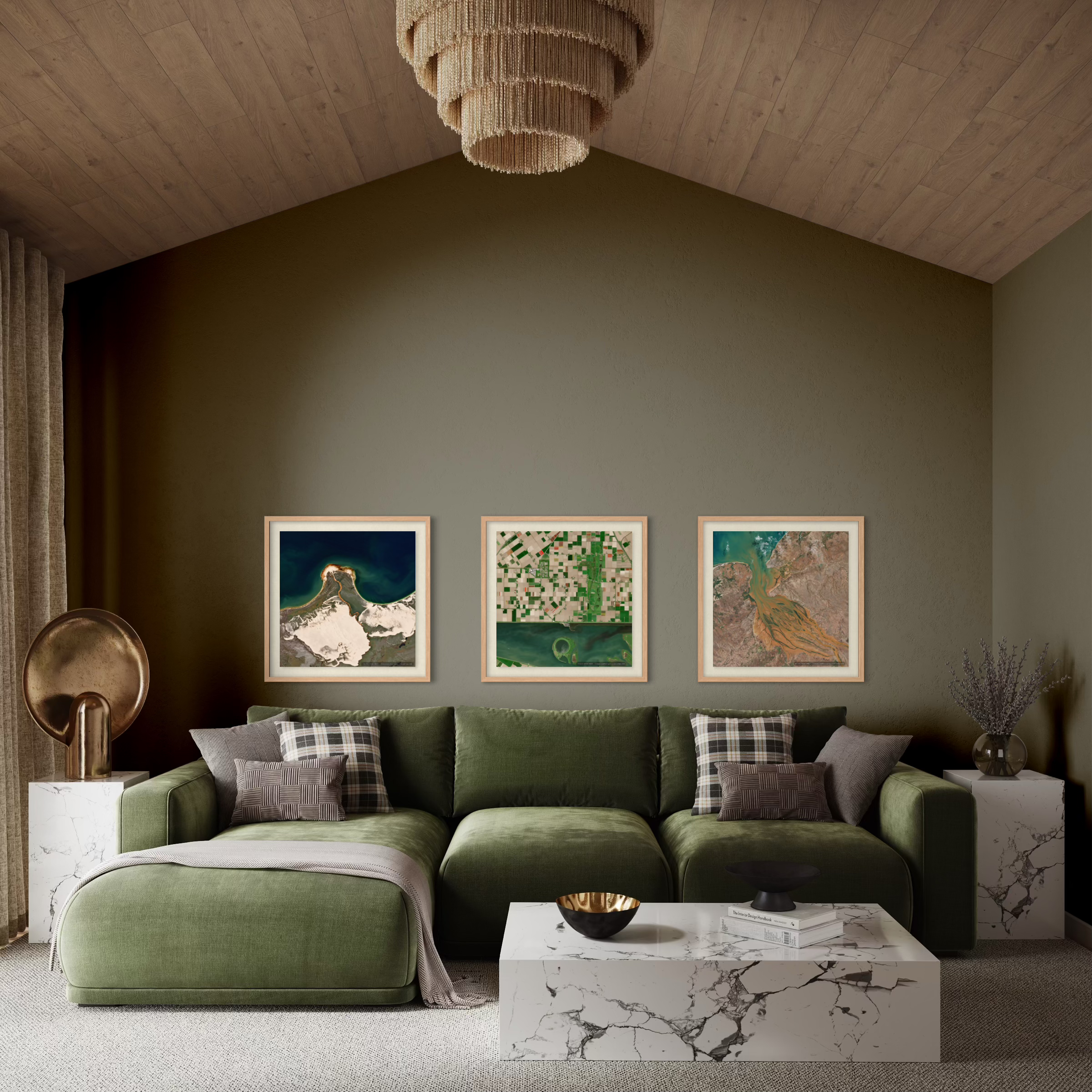 A styled living room featuring a large olive green sectional sofa with matching pillows, a white marble coffee table, and three framed landscape art prints on a dark olive green wall.