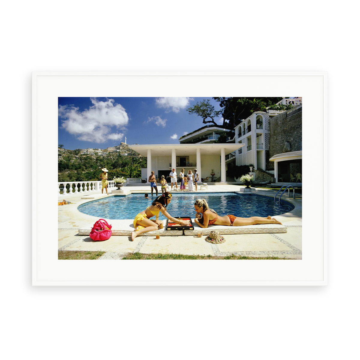 Illustrative matte-white framed preview with white inner border of Poolside Backgammon by Slim Aarons. Proportions vary by size.