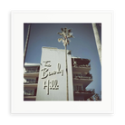 Illustrative matte-white framed preview with white inner border of The Beverly Hills Hotel by Slim Aarons. Proportions vary by size.