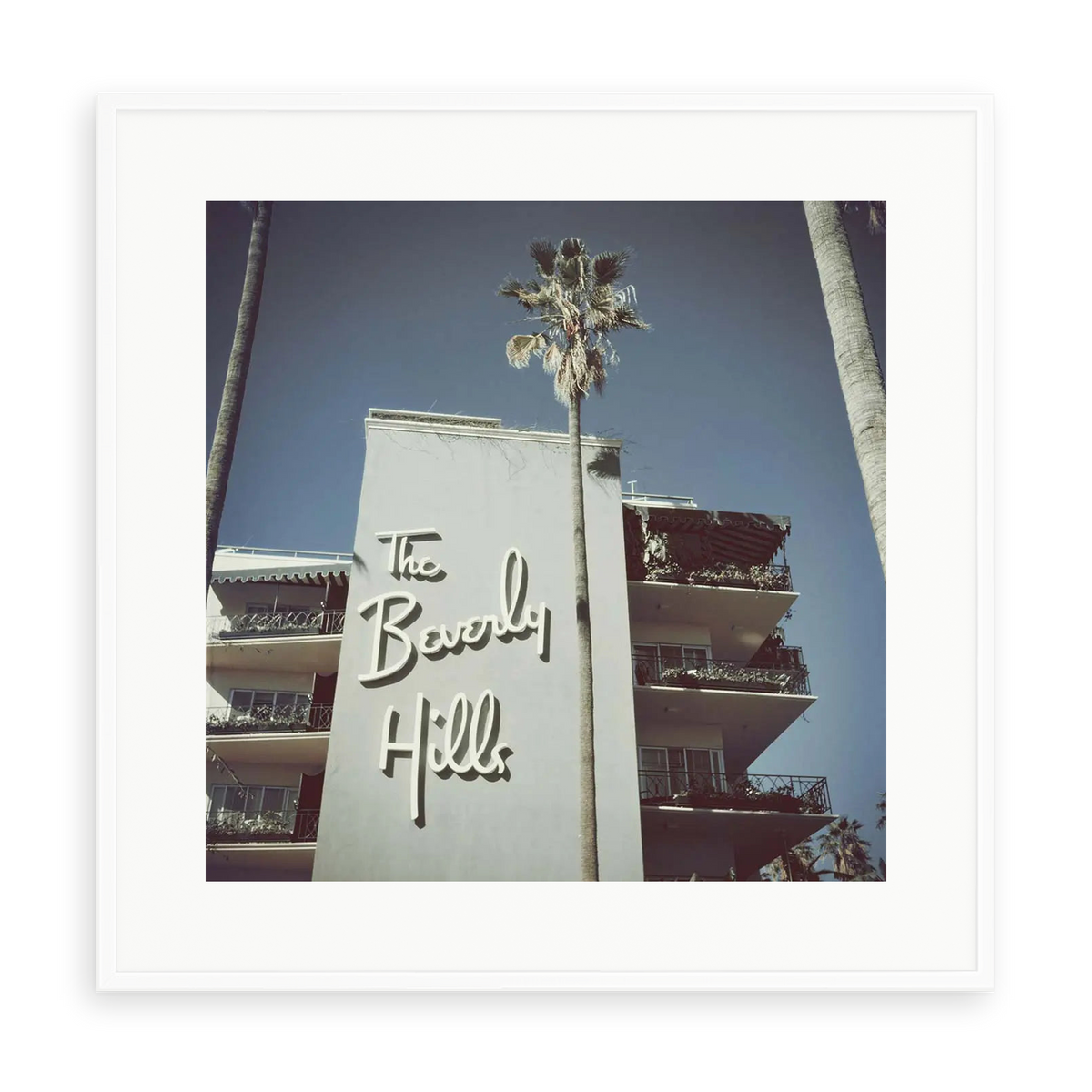 Illustrative matte-white framed preview with white inner border of The Beverly Hills Hotel by Slim Aarons. Proportions vary by size.