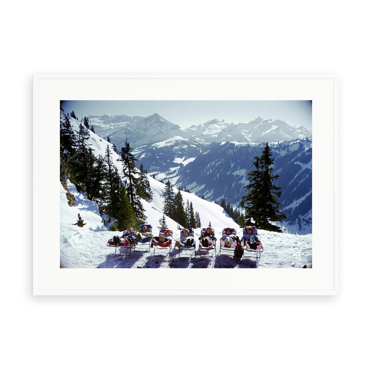 Illustrative matte-white framed preview with white inner border of Lounging in Gstaad by Slim Aarons. Proportions vary by size.