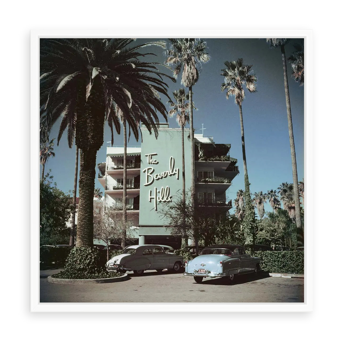 Illustrative matte-white floater-framed preview, without added mat, of Beverly Hills Hotel by Slim Aarons. Proportions vary by size.
