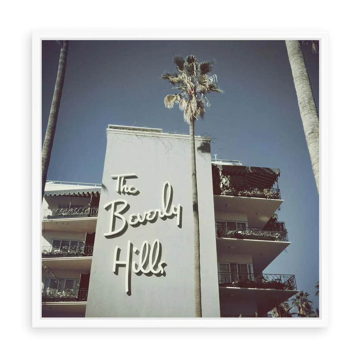 Illustrative matte-white floater-framed preview, without added mat, of The Beverly Hills Hotel by Slim Aarons. Proportions vary by size.