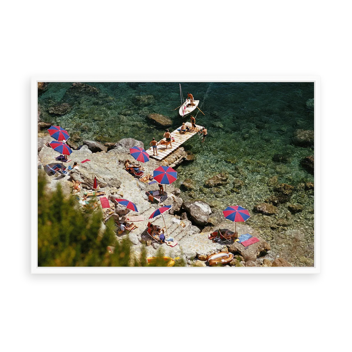 Illustrative matte-white floater-framed preview, without added mat, of Beach at Il Pellicano by Slim Aarons. Proportions vary by size.