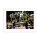 Illustrative matte-white framed preview with white inner border of Majorelle Gardens by Slim Aarons. Proportions vary by size.
