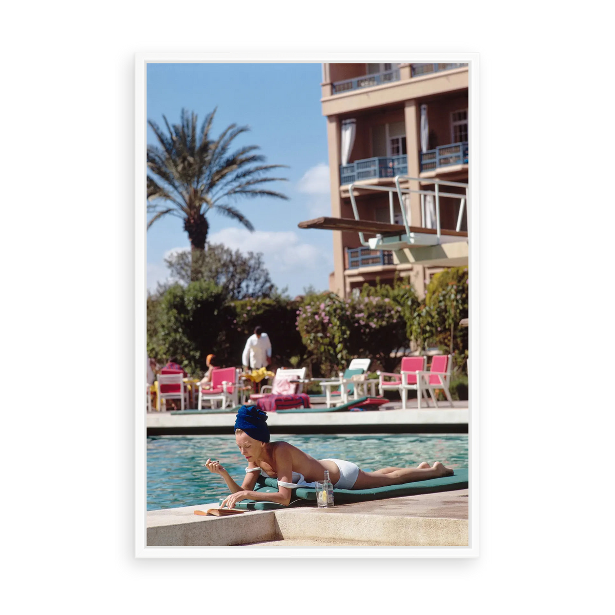 Illustrative matte-white floater-framed preview, without added mat, of Poolside in Marrakesh Morocco by Slim Aarons. Proportions vary by size.
