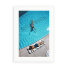 Illustrative matte-white framed preview with white inner border of Swimmer And Sunbather by Slim Aarons. Proportions vary by size.