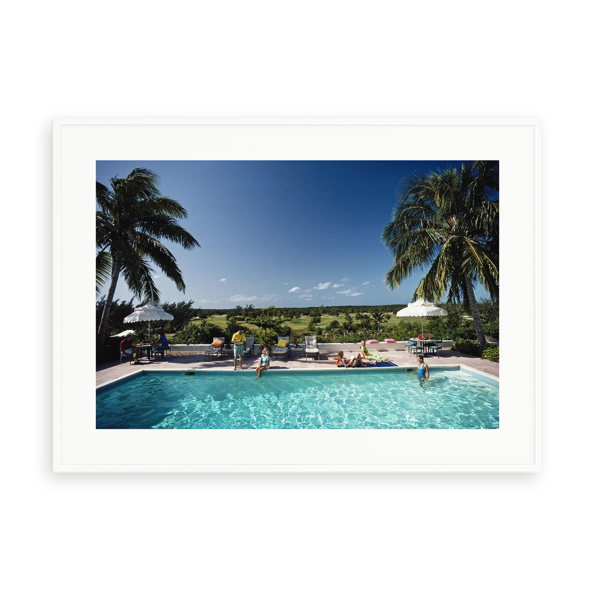 Illustrative matte-white framed preview with white inner border of Cotton Bay by Slim Aarons. Proportions vary by size.