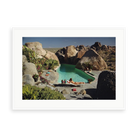 Illustrative matte-white framed preview with white inner border of Sunbathing In Arizona by Slim Aarons. Proportions vary by size.