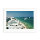 Illustrative matte-white framed preview with white inner border of Aerial Miami Beach by Slim Aarons. Proportions vary by size.