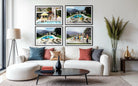 A styled living room featuring a white sectional sofa with accent pillows, a black coffee table, and a large wall art set consisting of four framed photographs of poolside scenes. The Picturalist Wall Art and Photography for Designed Interiors. Slim Aarons Collection, Poolside. Getty Images Gallery. 