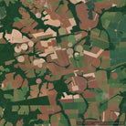 Aerial satellite view of a patchwork of agricultural fields in shades of green, brown, and beige, with several circular center-pivot crop patterns visible.