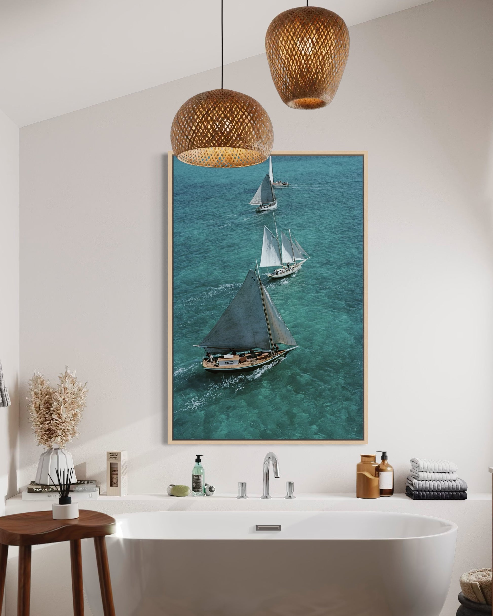 Bathroom interior with a large framed picture of sailboats on the wall.