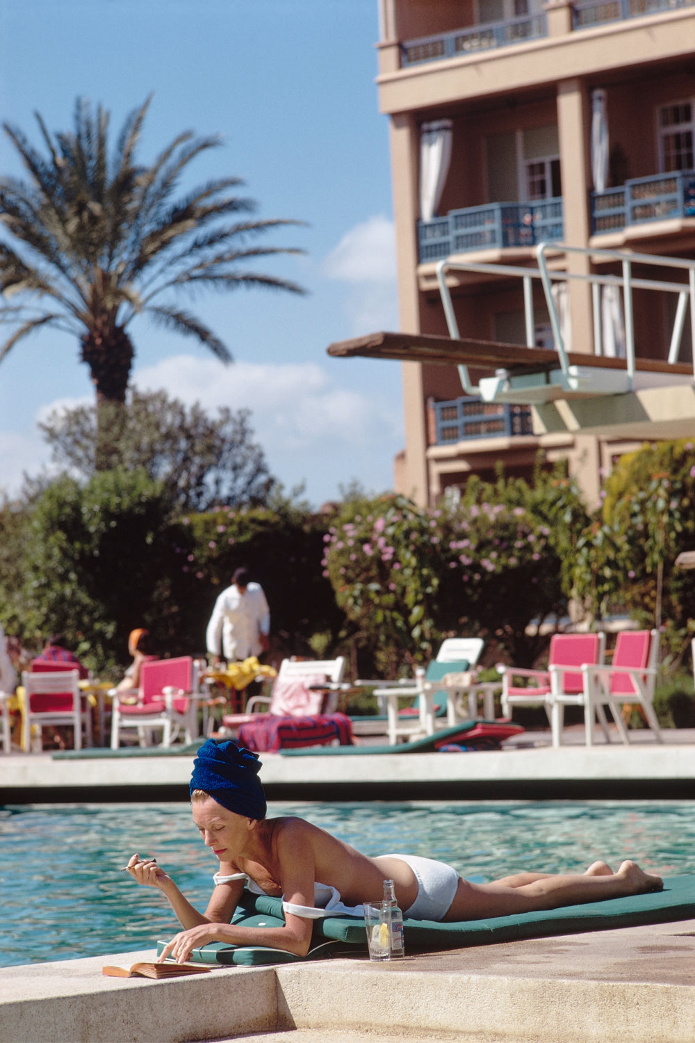 Poolside in Marrakesh Morocco by Slim Aarons featuring elegant resort leisure and Moroccan architecture in a luxury poolside setting