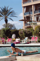 Poolside in Marrakesh Morocco by Slim Aarons featuring elegant resort leisure and Moroccan architecture in a luxury poolside setting