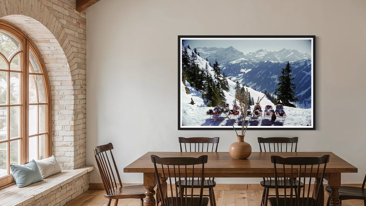 Slim Aarons’ Lounging in Gstaad styled in a boutique hotel lounge, offering framed art for hospitality and aesthetic solutions for hospitality designers.