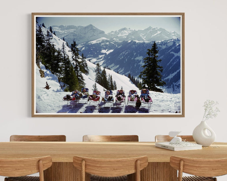 Lounging in Gstaad by Slim Aarons in a refined dining space, enhancing high-end interior design with bespoke art prints and turnkey art solutions.