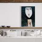 Framed artwork of a boat and people on a wall above a sofa.