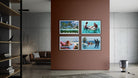 A set of four framed tropical beach and poolside photographs displayed in a 2x2 grid on a terracotta-colored wall in a modern, minimalist living room.