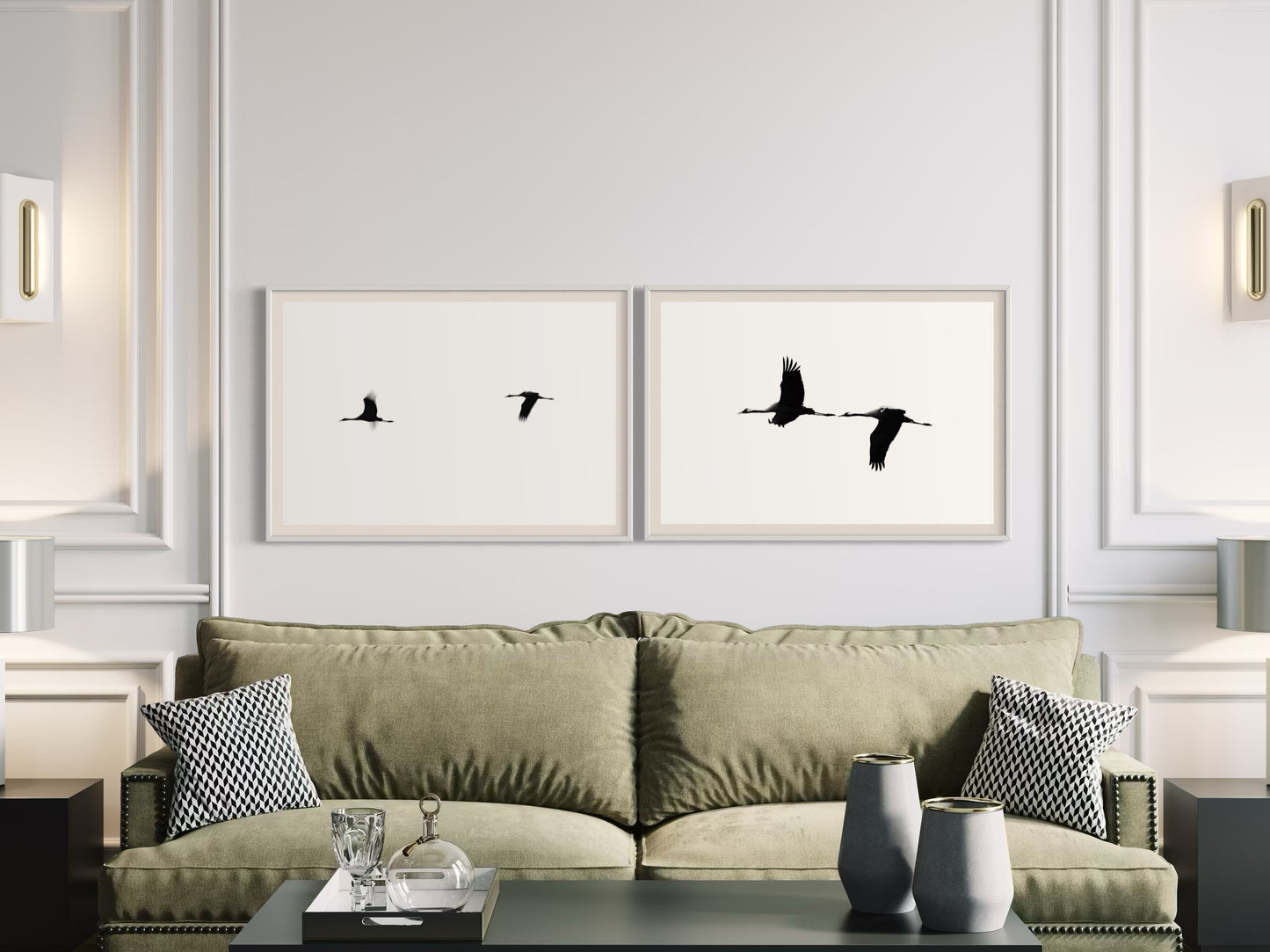 Living room with a green sofa, decorative pillows, and framed artwork of birds on the wall.