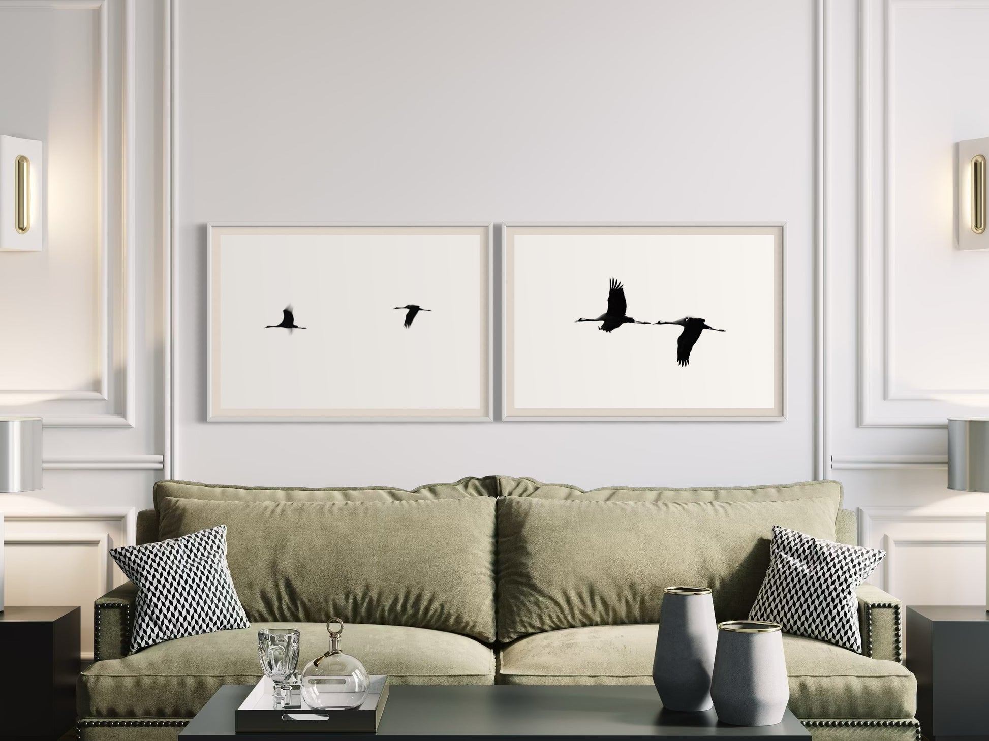 Living room with a green sofa, decorative pillows, and framed artwork of birds on the wall.