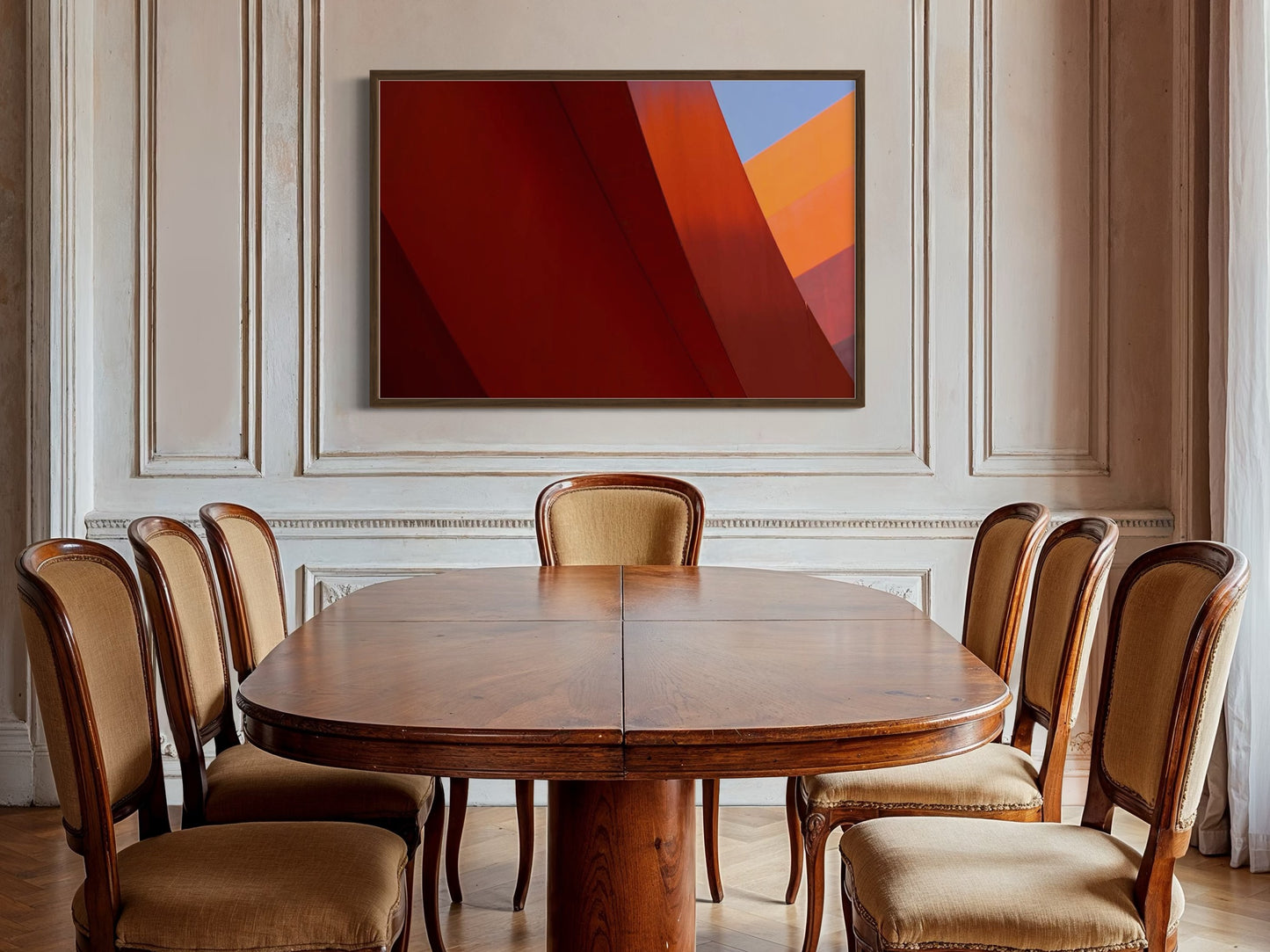 Dining room with wooden table and chairs, abstract art on the wall.