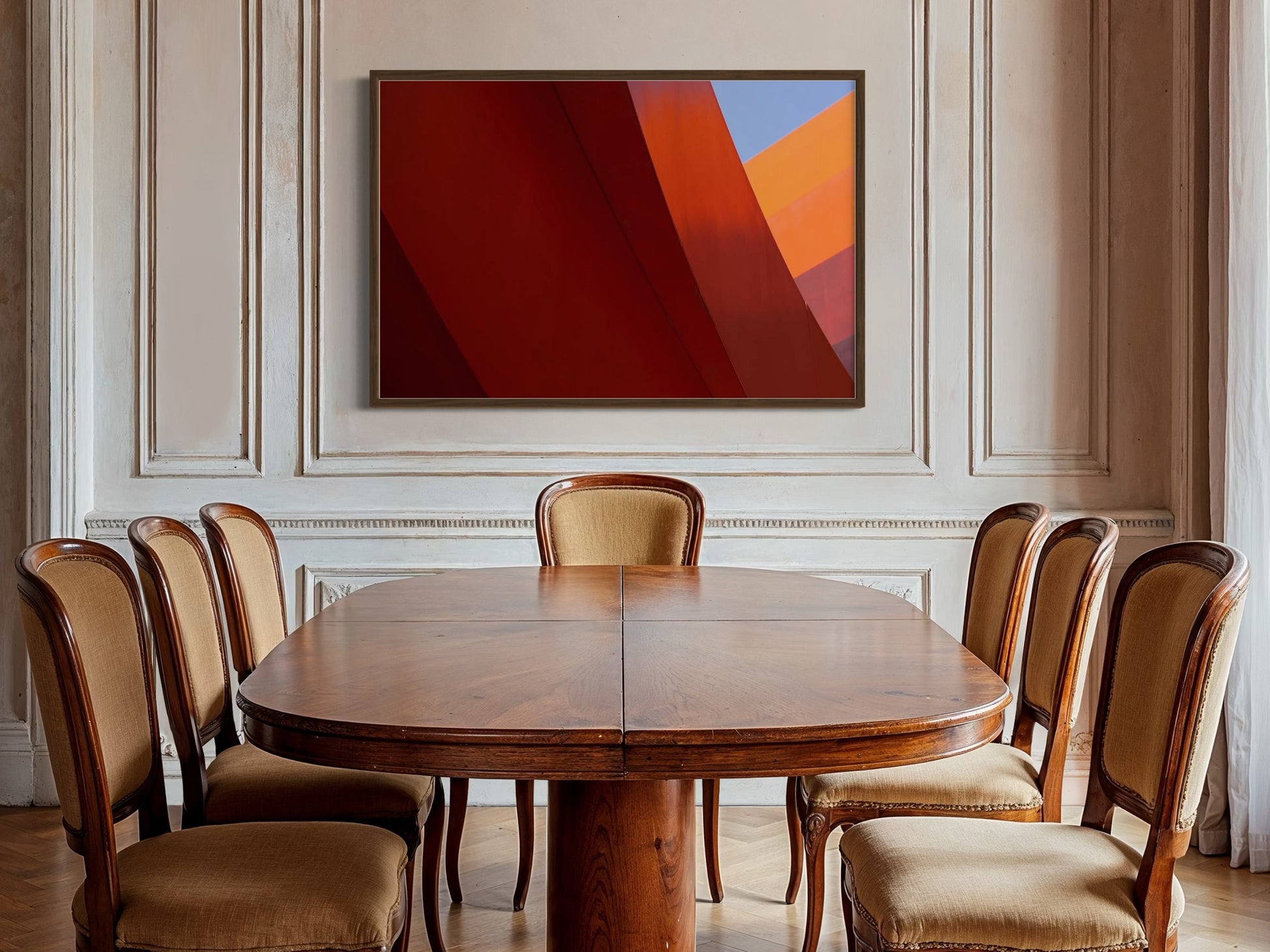 Dining room with wooden table and chairs, abstract art on the wall.