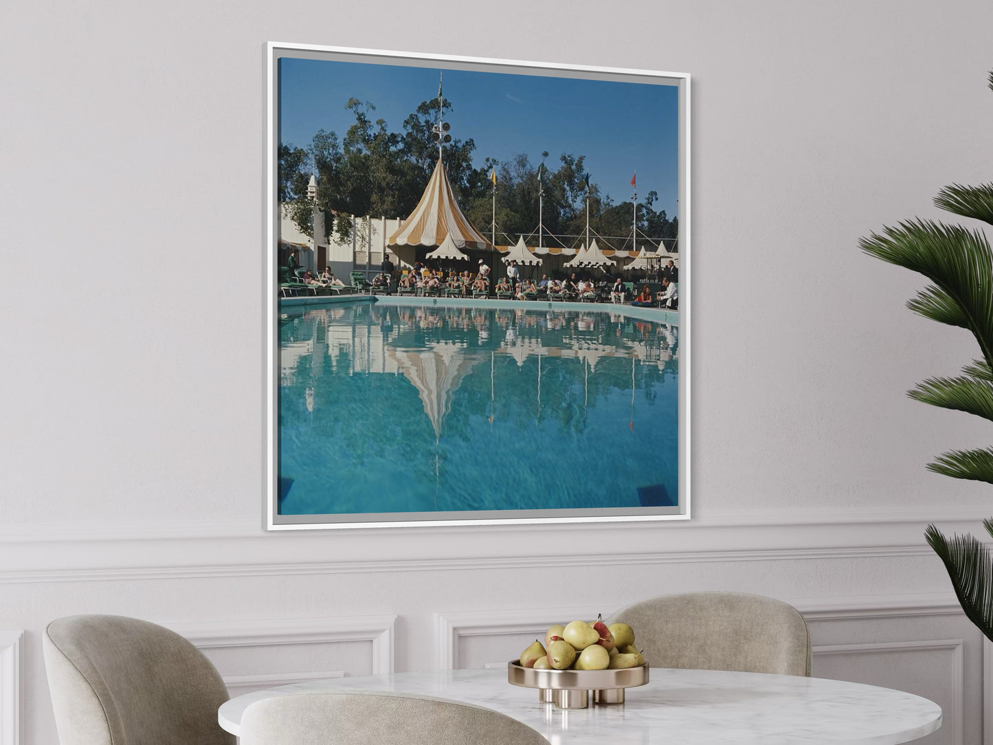 Metal Print Framed photograph of a poolside scene with tents on a wall above a dining table.