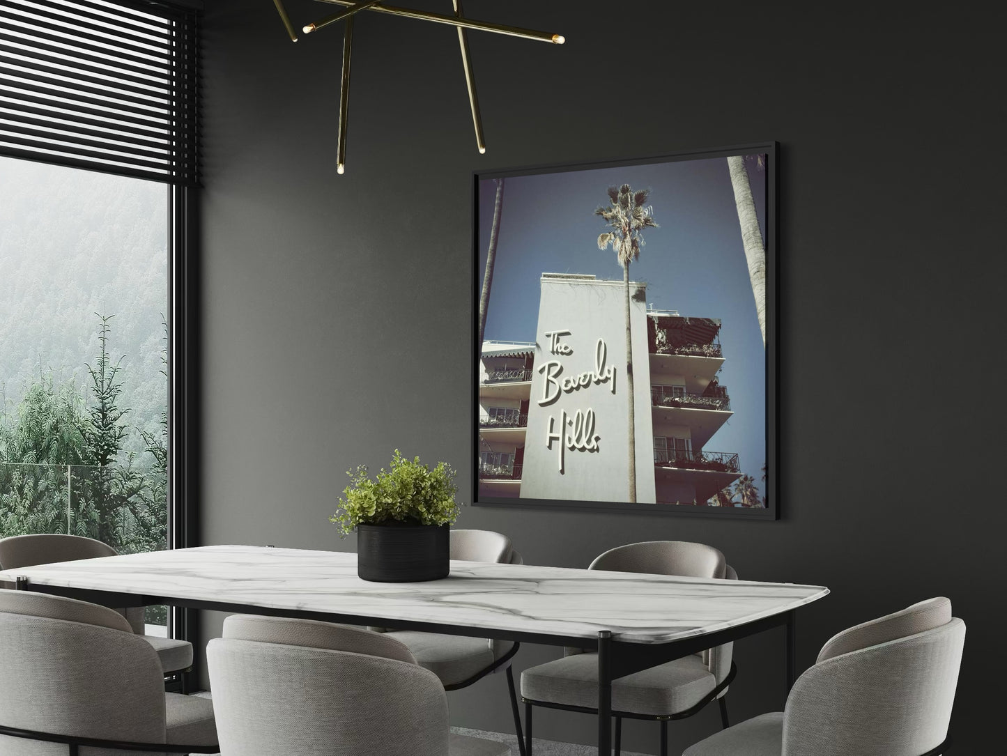 Modern dining room with a framed picture of a building on the wall.