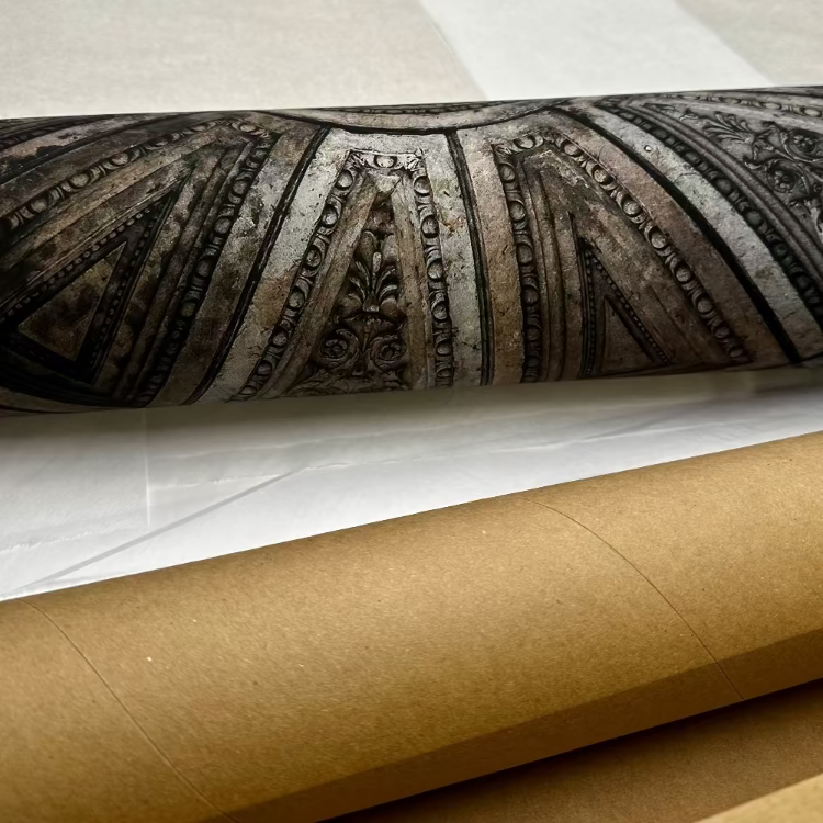 Decorative scroll with intricate patterns on a white background